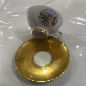Gold and White Teacup with Saucer